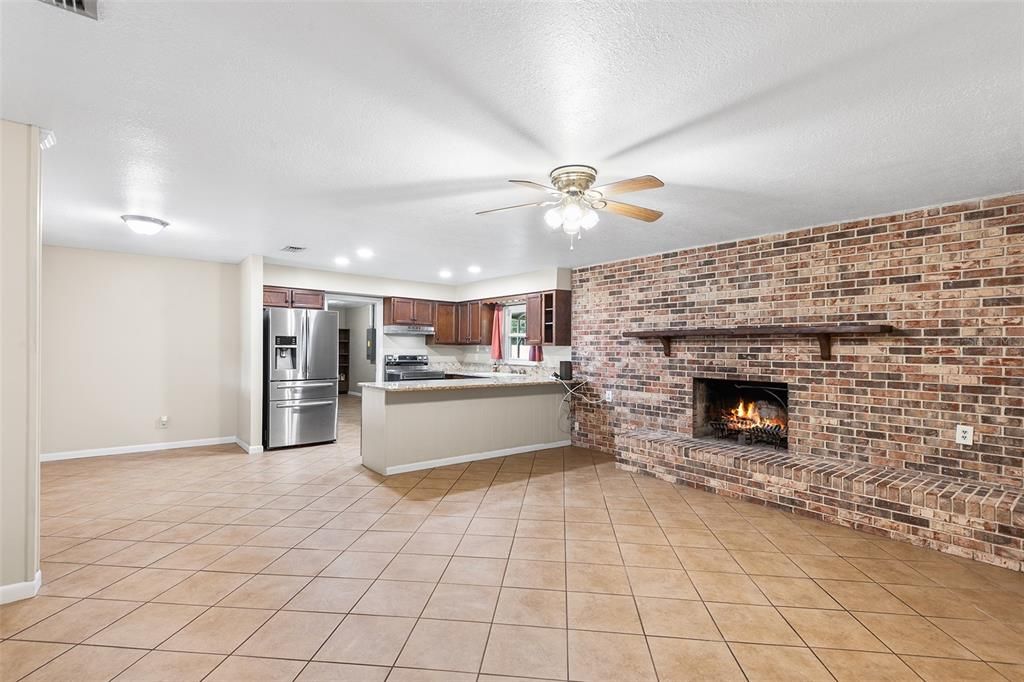 Fireplace, Interior, Kitchen, Recessed Lighting, Stainless Steel Appliances, Stone Walls