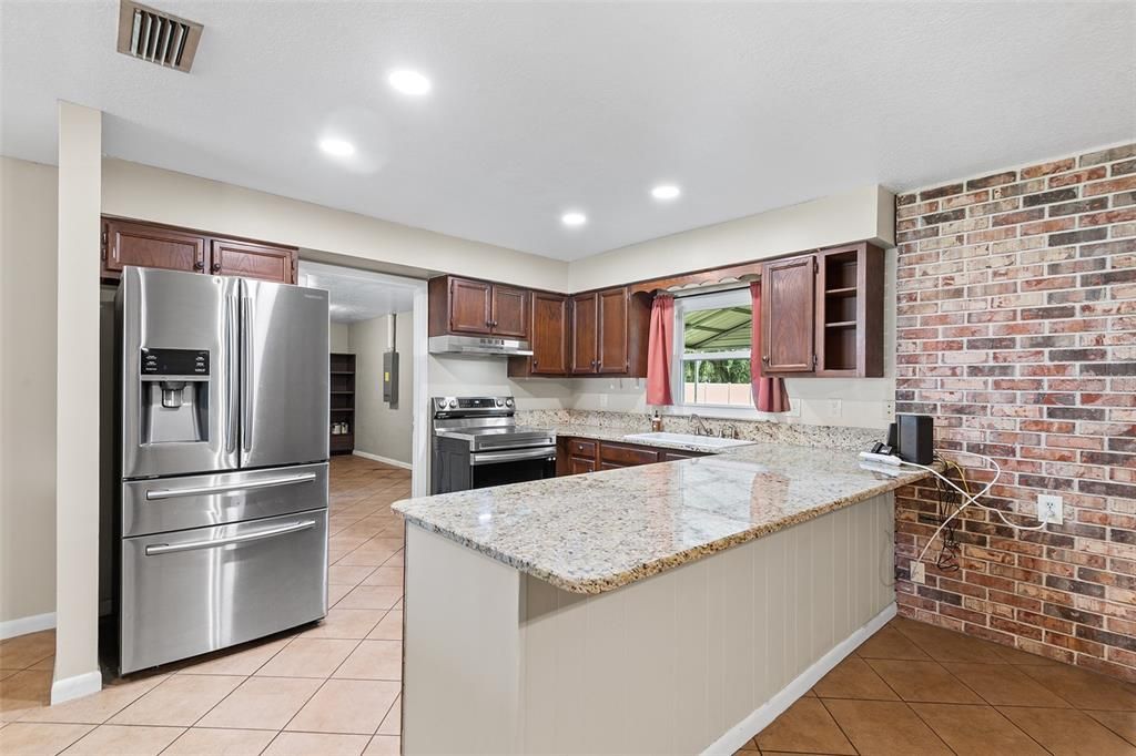 Interior, Kitchen, Recessed Lighting, Stainless Steel Appliances, Stone Walls