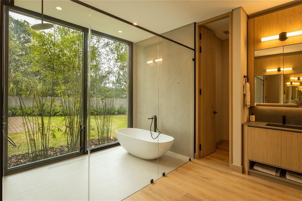 Bathroom, Free Standing Baths, Glass Shower, Interior, Recessed Lighting, Wood Texture Flooring