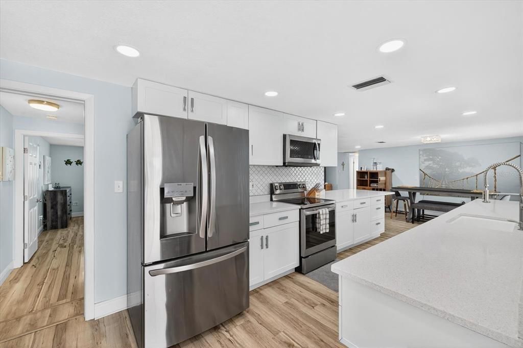 Dining room, Interior, Kitchen, Recessed Lighting, Stainless Steel Appliances, Wood Texture Flooring