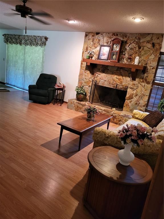 Fireplace, Interior, Living room, Recessed Lighting, Stone Walls, Wood Texture Flooring