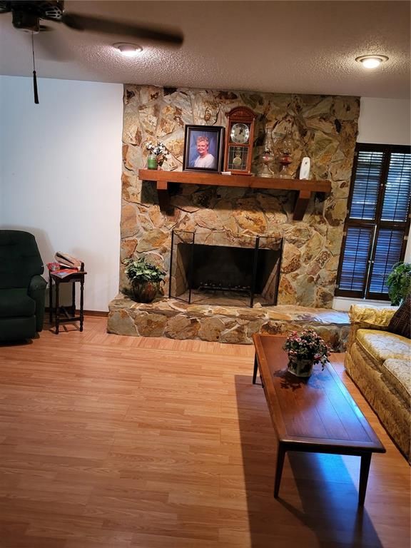 Fireplace, Interior, Living room, Recessed Lighting, Stone Walls, Wood Texture Flooring