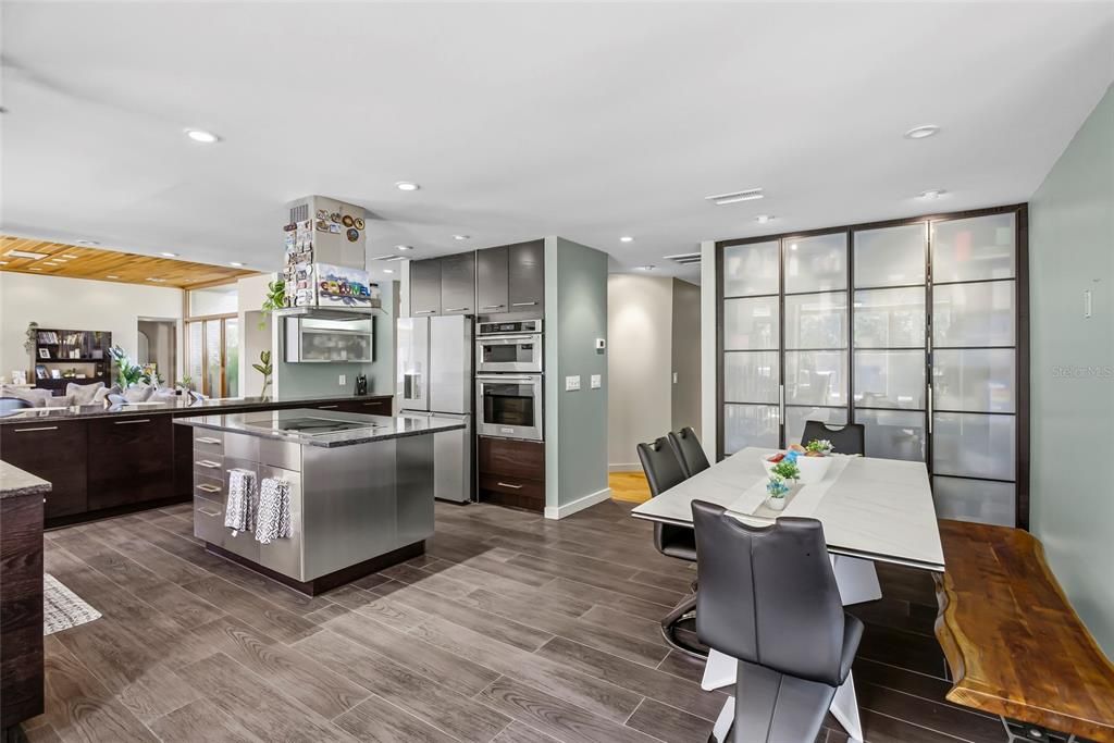 Dining room, Interior, Kitchen, Pendant Lights, Recessed Lighting, Stainless Steel Appliances, Wood Texture Flooring