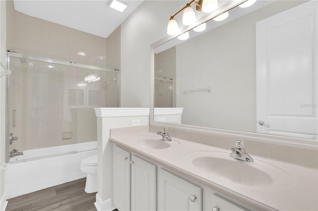 Bathroom, Dual Sink Vanities, Glass Shower, Interior, Wood Texture Flooring