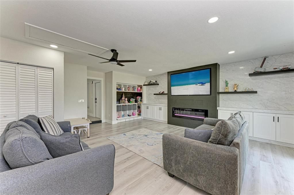 Fireplace, Interior, Living room, Marble Walls, Recessed Lighting, Wood Texture Flooring