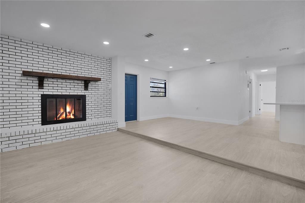 Empty room, Fireplace, Interior, Recessed Lighting, Stone Walls, Wood Texture Flooring