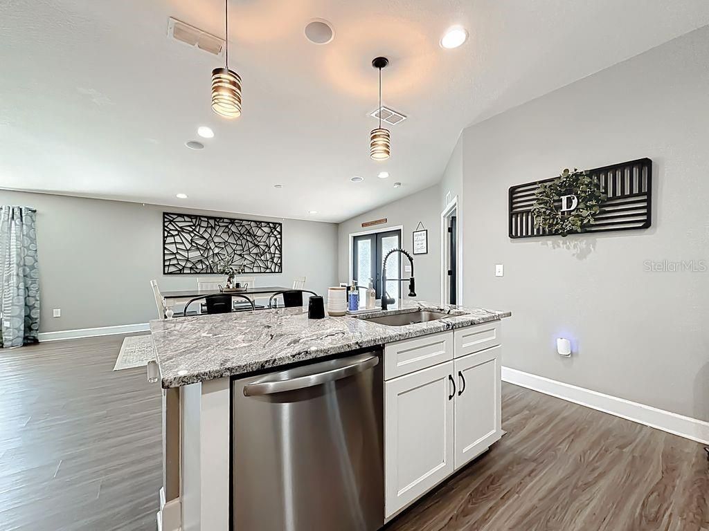 Dining room, Interior, Kitchen, Pendant Lights, Recessed Lighting, Stainless Steel Appliances, Wood Texture Flooring