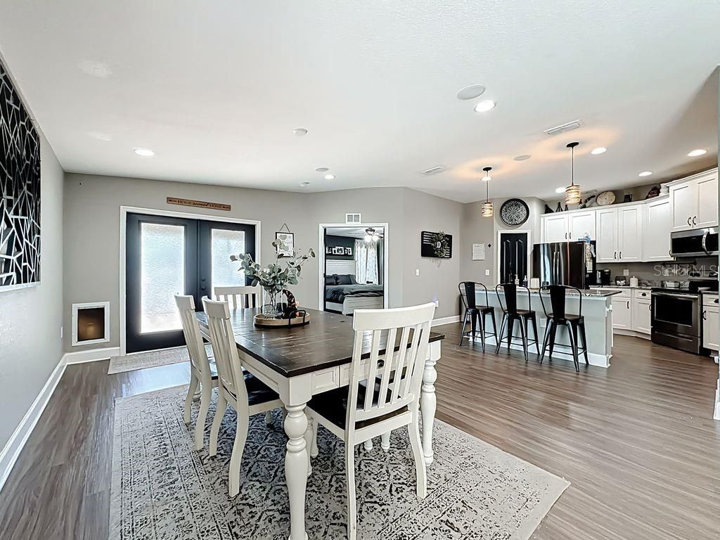 Dining room, Interior, Kitchen, Pendant Lights, Recessed Lighting, Stainless Steel Appliances, Wood Texture Flooring