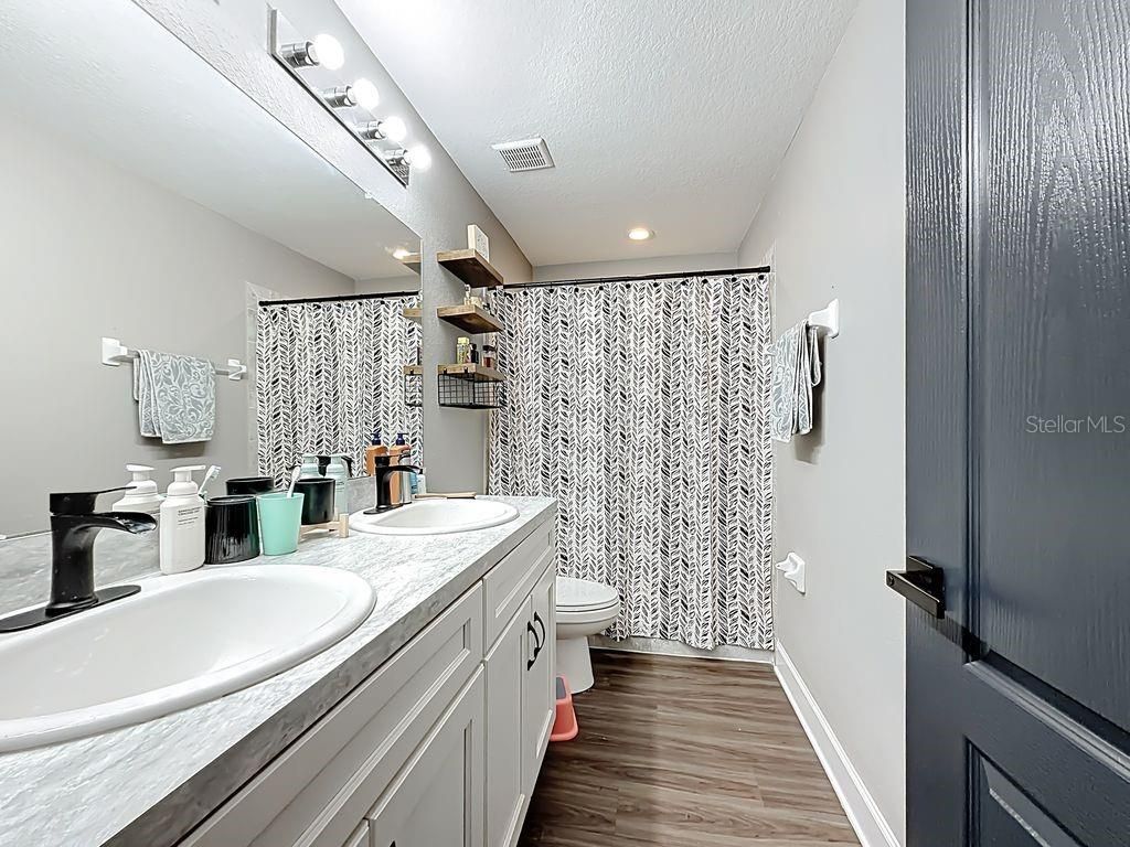 Bathroom, Dual Sink Vanities, Interior, Recessed Lighting, Wood Texture Flooring