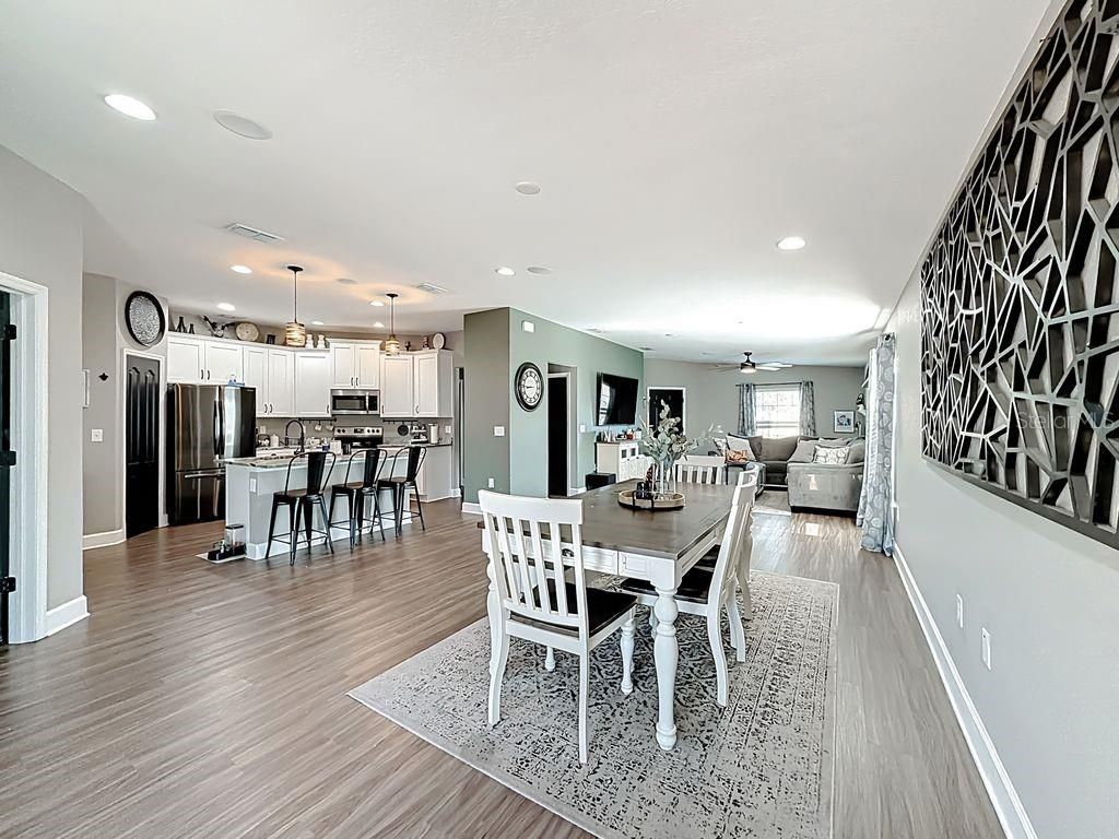 Dining room, Interior, Kitchen, Pendant Lights, Recessed Lighting, Stainless Steel Appliances, Wood Texture Flooring
