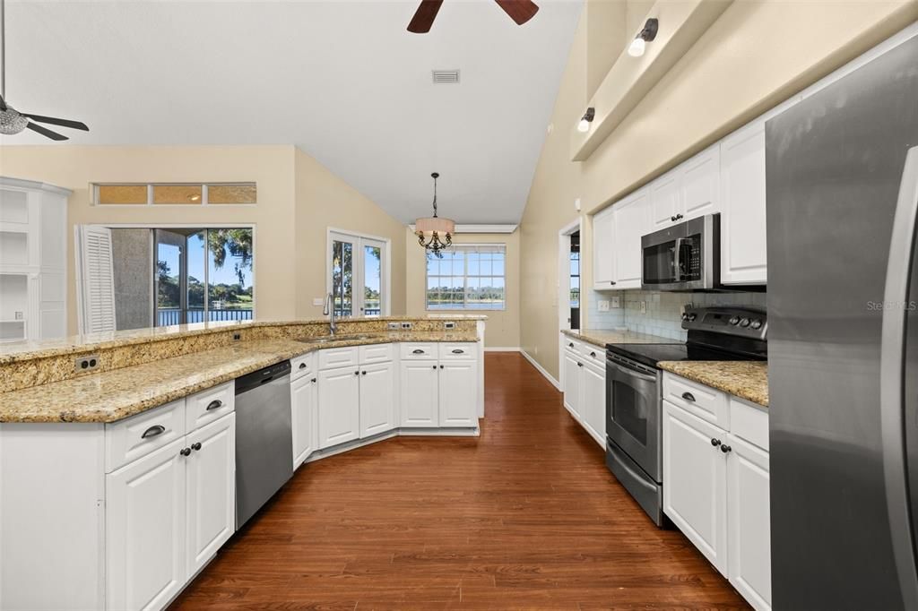 Chandelier, Interior, Kitchen, Pendant Lights, Stainless Steel Appliances, Wood Texture Flooring