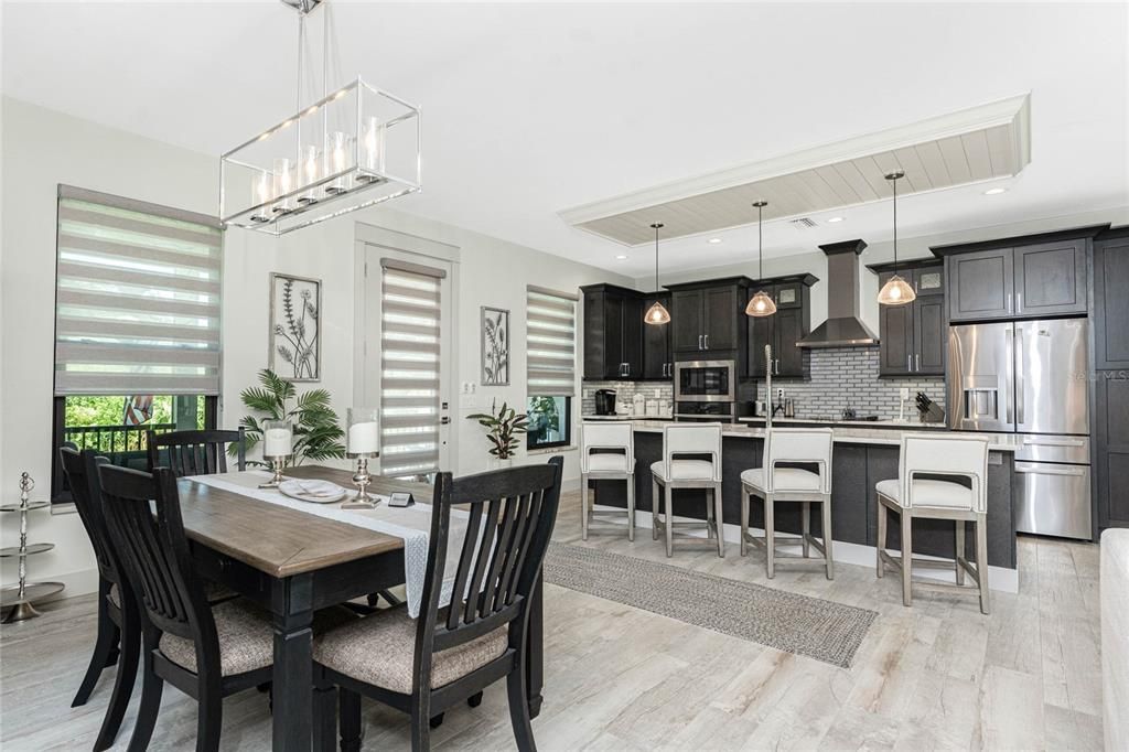 Dining room, Interior, Kitchen, Pendant Lights, Recessed Lighting, Stainless Steel Appliances, Wood Texture Flooring