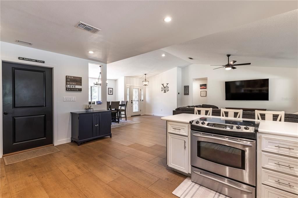 Dining room, Interior, Kitchen, Pendant Lights, Recessed Lighting, Stainless Steel Appliances, Wood Texture Flooring