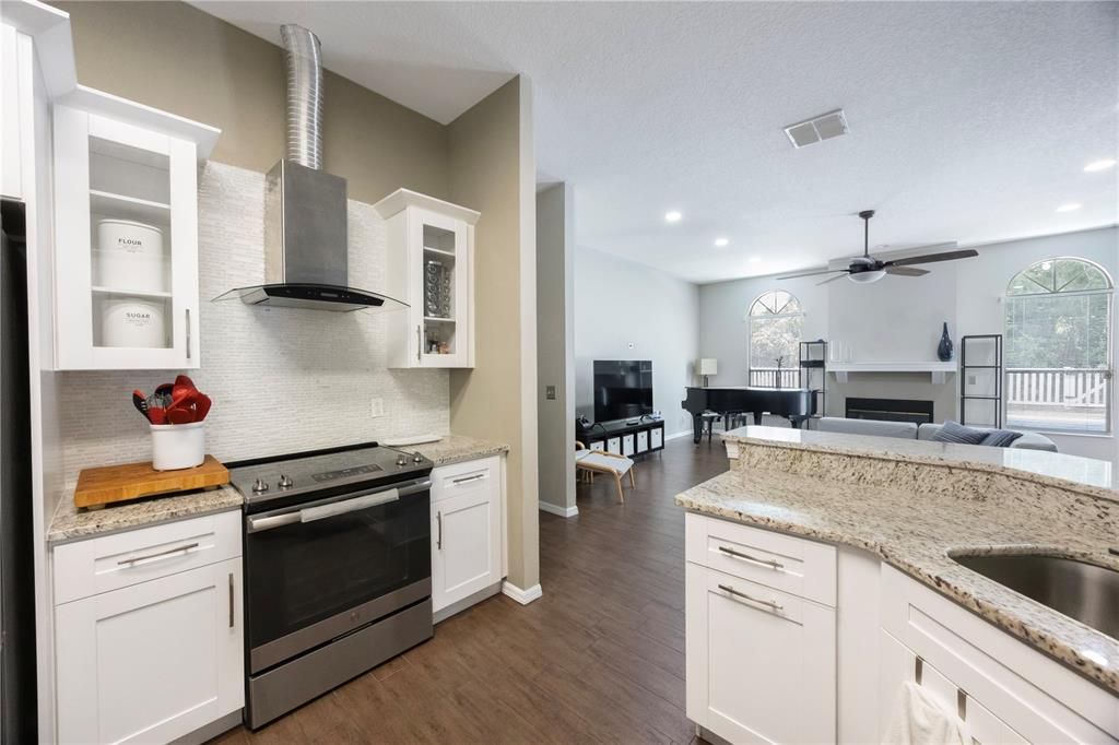 Dining room, Interior, Kitchen, Recessed Lighting, Stainless Steel Appliances, Wood Texture Flooring