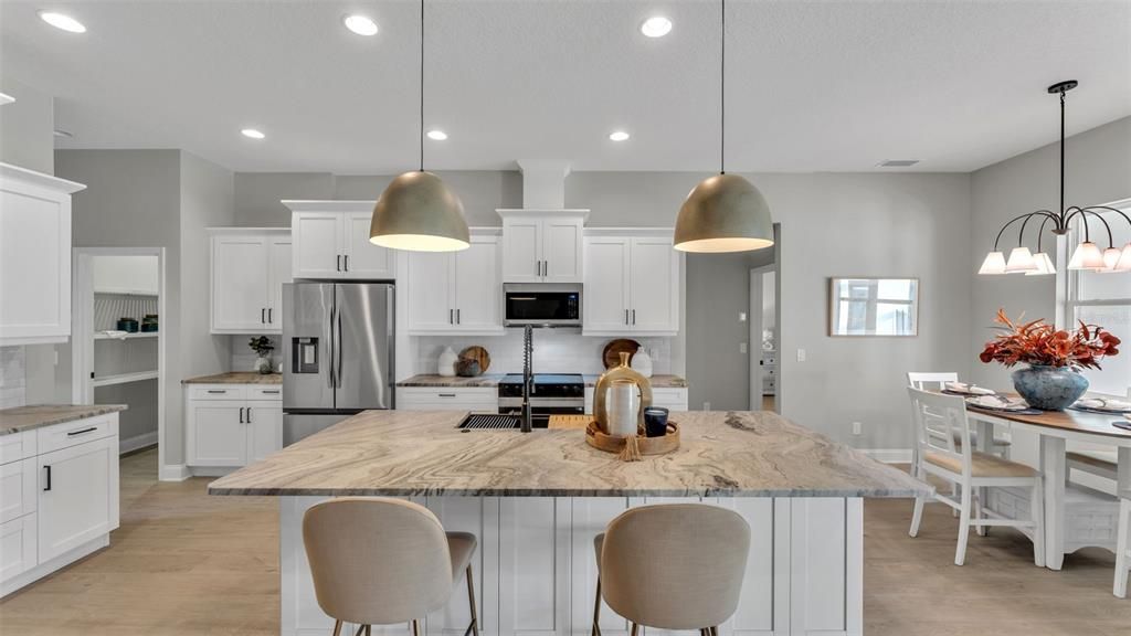 Dining room, Interior, Kitchen, Pendant Lights, Recessed Lighting, Stainless Steel Appliances, Wood Texture Flooring