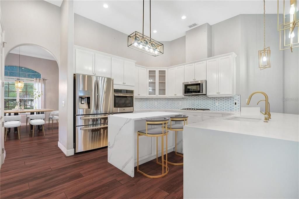 Dining room, Interior, Kitchen, Pendant Lights, Recessed Lighting, Stainless Steel Appliances, Wood Texture Flooring