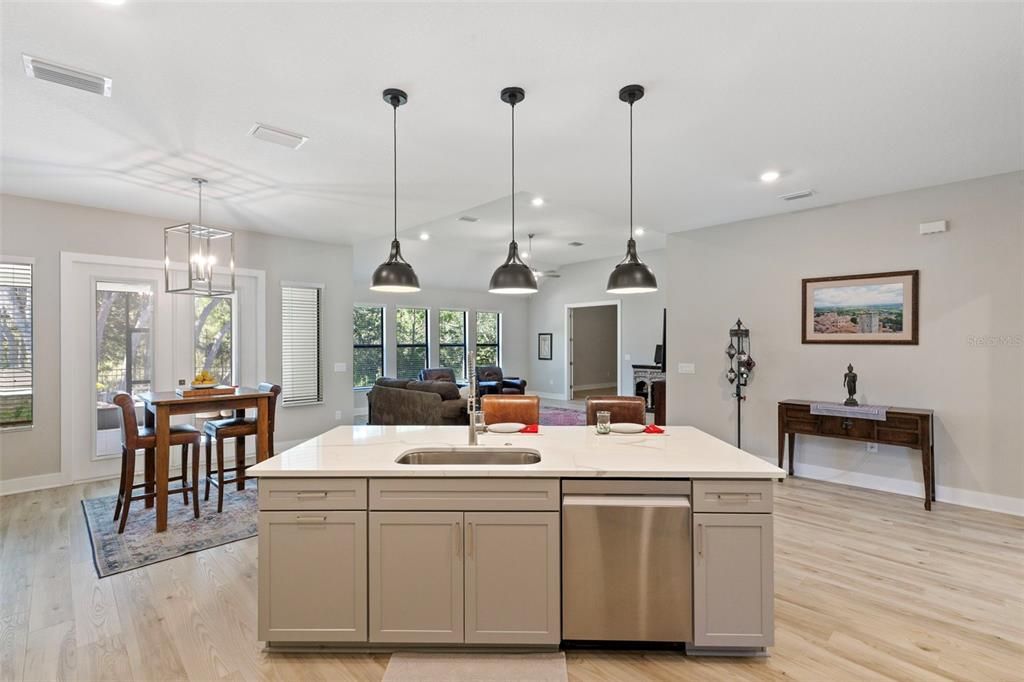 Dining room, Interior, Kitchen, Pendant Lights, Recessed Lighting, Stainless Steel Appliances, Wood Texture Flooring