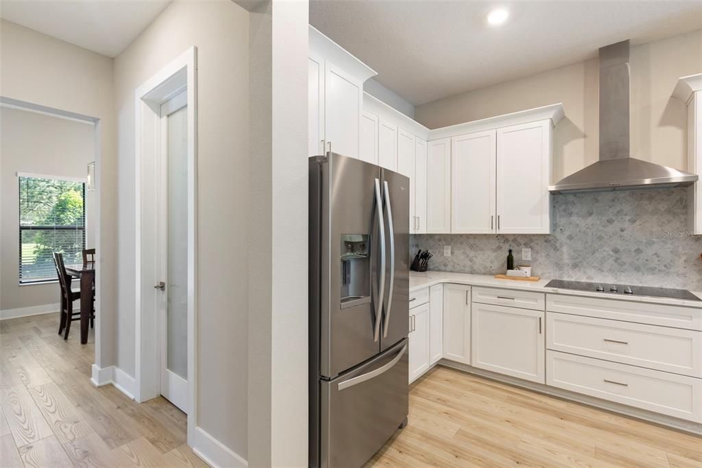 Dining room, Interior, Kitchen, Recessed Lighting, Stainless Steel Appliances, Wood Texture Flooring