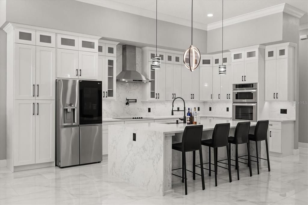 Interior, Kitchen, Marble, Marble Walls, Pendant Lights, Recessed Lighting, Stainless Steel Appliances