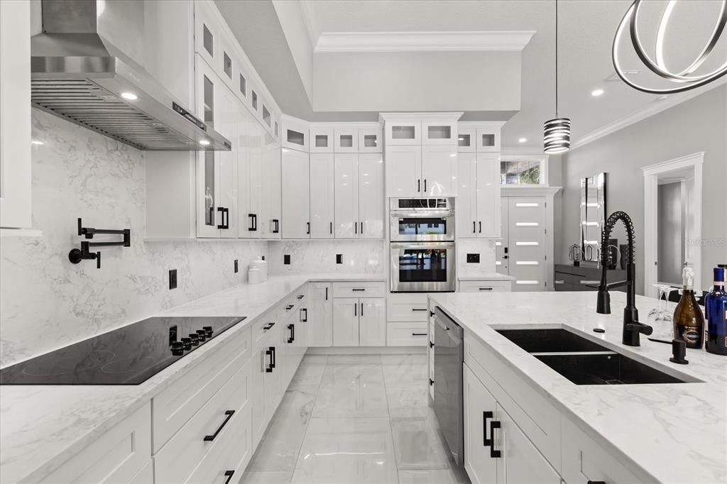 Interior, Kitchen, Marble, Marble Walls, Pendant Lights, Recessed Lighting, Stainless Steel Appliances