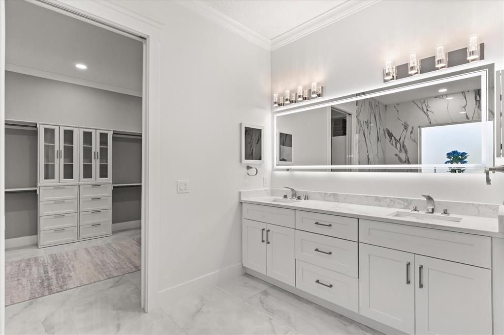 Bathroom, Dual Sink Vanities, Interior, Marble, Marble Walls, Recessed Lighting, Walk-in Closets