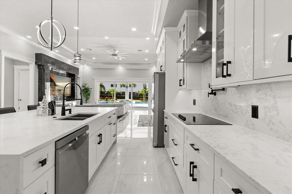 Interior, Kitchen, Marble Walls, Pendant Lights, Recessed Lighting, Stainless Steel Appliances