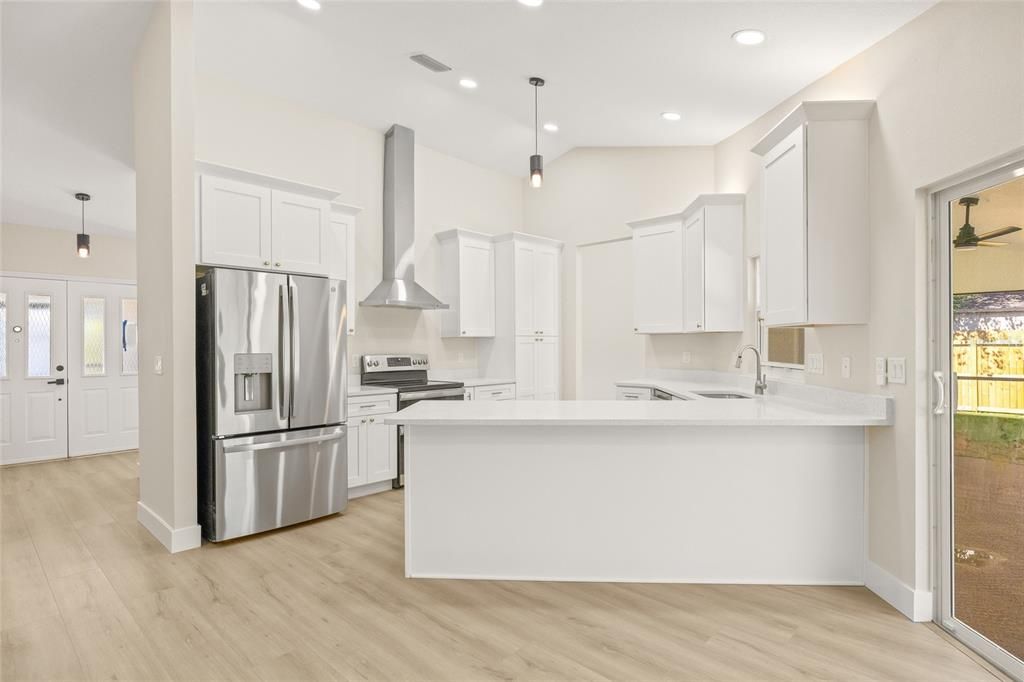 Interior, Kitchen, Pendant Lights, Recessed Lighting, Stainless Steel Appliances, Wood Texture Flooring