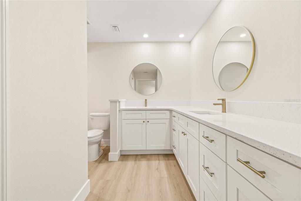 Bathroom, Dual Sink Vanities, Interior, Recessed Lighting, Wood Texture Flooring