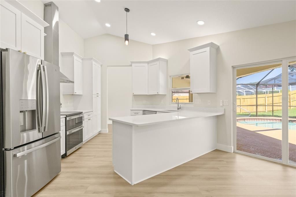 Glass Ceilings, Interior, Kitchen, Pendant Lights, Recessed Lighting, Stainless Steel Appliances, Wood Texture Flooring