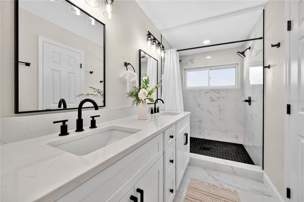 Bathroom, Dual Sink Vanities, Glass Shower, Interior, Marble, Marble Walls, Recessed Lighting