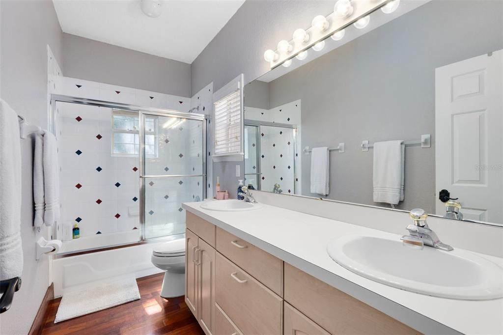 Bathroom, Dual Sink Vanities, Glass Shower, Interior, Wood Texture Flooring