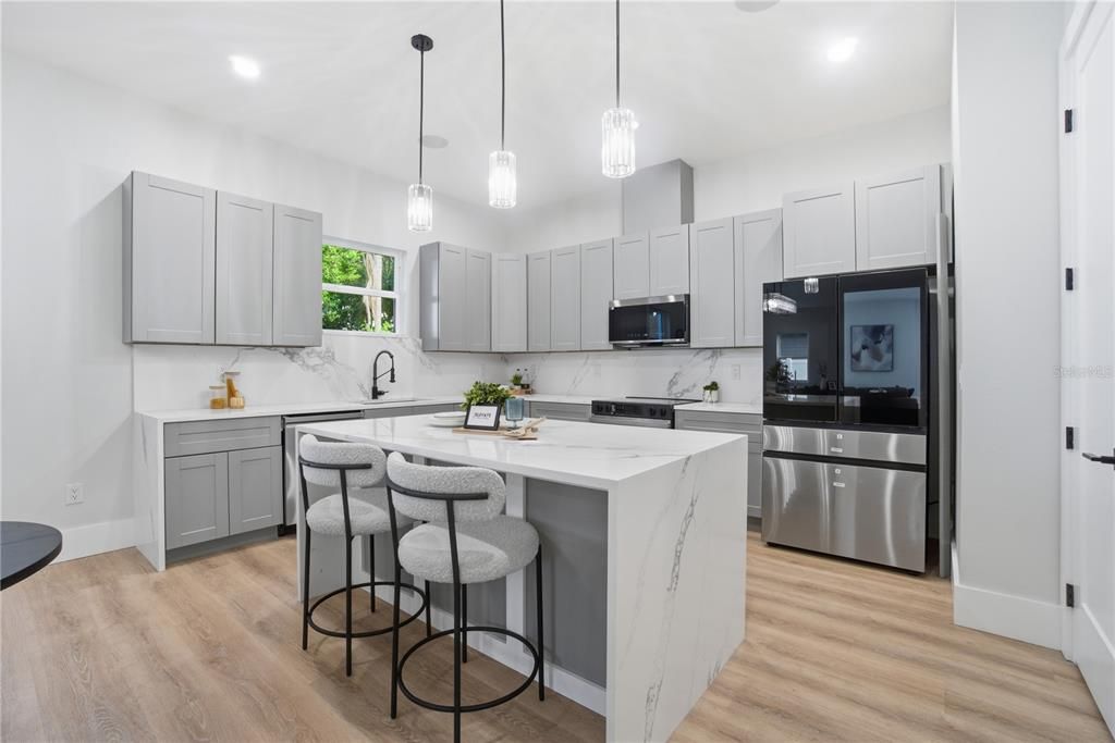 Interior, Kitchen, Marble Walls, Pendant Lights, Recessed Lighting, Stainless Steel Appliances, Wood Texture Flooring