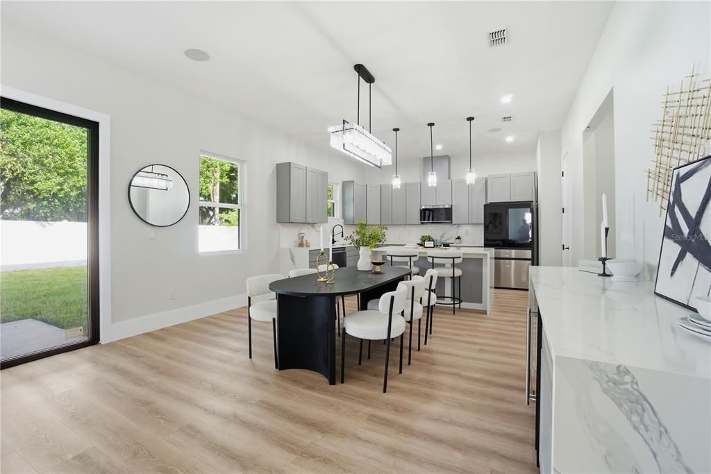 Dining room, Interior, Kitchen, Pendant Lights, Recessed Lighting, Stainless Steel Appliances, Wood Texture Flooring