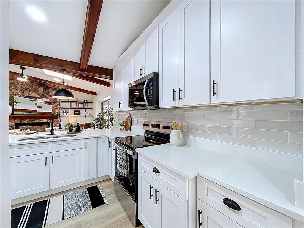 Interior, Kitchen, Pendant Lights, Recessed Lighting, Stainless Steel Appliances, Stone Walls, Wooden Beams, Wood Texture Flooring