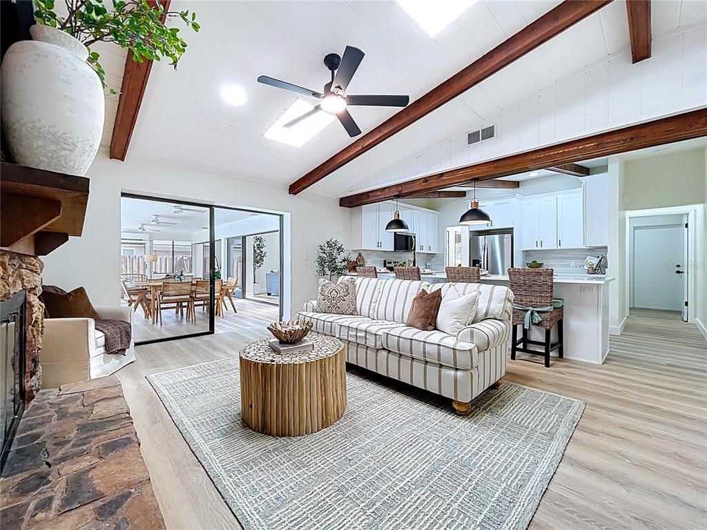 Dining room, Fireplace, Interior, Kitchen, Living room, Pendant Lights, Recessed Lighting, Stainless Steel Appliances, Wood Texture Flooring