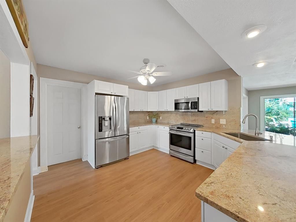 Interior, Kitchen, Recessed Lighting, Stainless Steel Appliances, Wood Texture Flooring