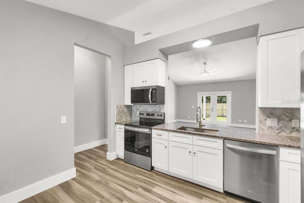 Interior, Kitchen, Recessed Lighting, Stainless Steel Appliances, Wood Texture Flooring