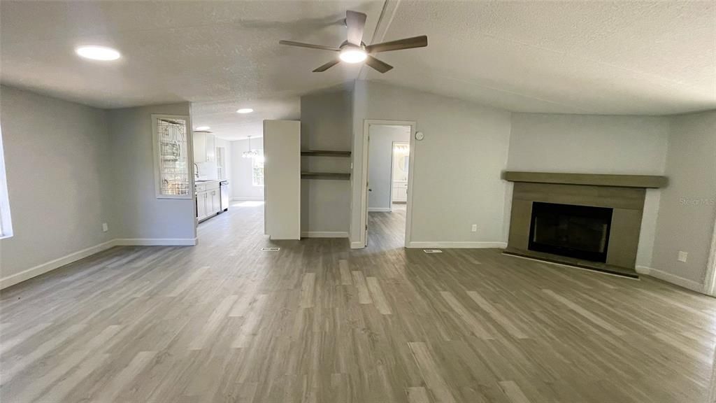 Empty room, Fireplace, Interior, Recessed Lighting, Wood Texture Flooring