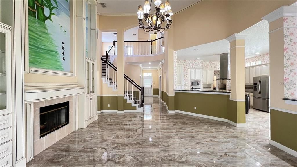 Chandelier, Fireplace, Interior, Kitchen, Marble, Recessed Lighting, Stainless Steel Appliances