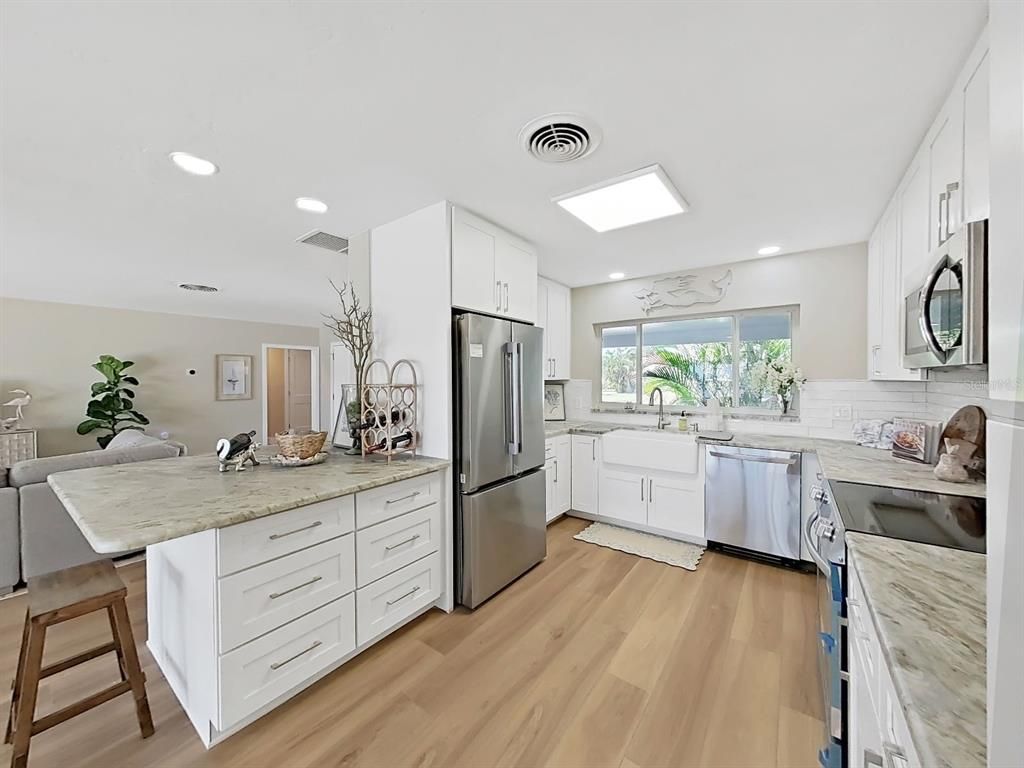 Interior, Kitchen, Recessed Lighting, Stainless Steel Appliances, Wood Texture Flooring