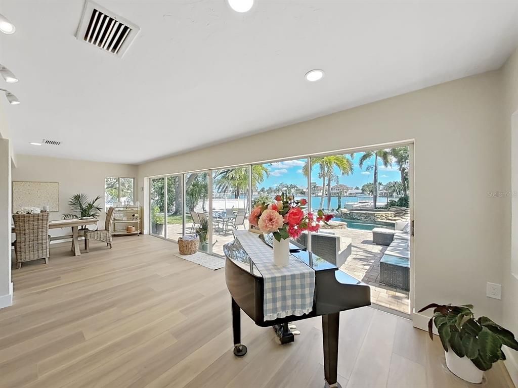 Dining room, Interior, Piano, Recessed Lighting, Water, Wood Texture Flooring