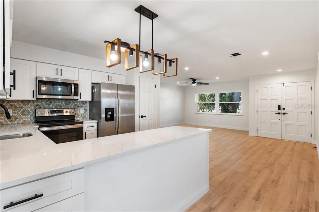 Interior, Kitchen, Pendant Lights, Recessed Lighting, Stainless Steel Appliances, Wood Texture Flooring