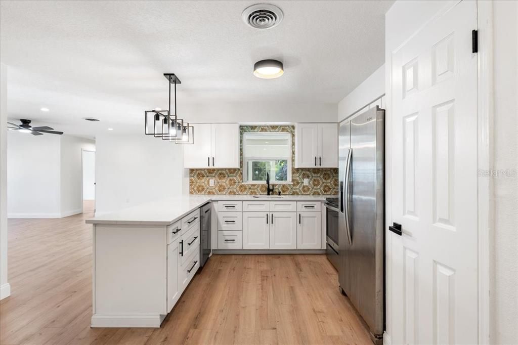Interior, Kitchen, Pendant Lights, Recessed Lighting, Stainless Steel Appliances, Wood Texture Flooring