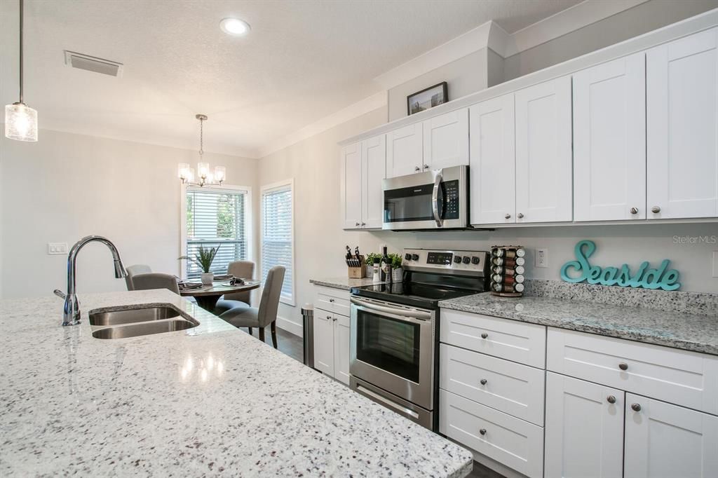Chandelier, Dining room, Interior, Kitchen, Pendant Lights, Recessed Lighting, Stainless Steel Appliances