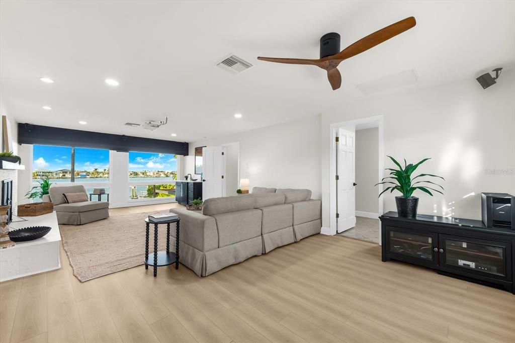 Fireplace, Interior, Living room, Recessed Lighting, Water, Wood Texture Flooring