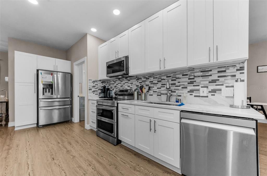 Interior, Kitchen, Recessed Lighting, Stainless Steel Appliances, Wood Texture Flooring