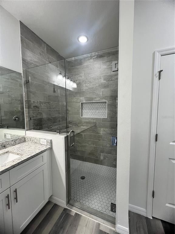 Bathroom, Glass Shower, Interior, Recessed Lighting, Wood Texture Flooring