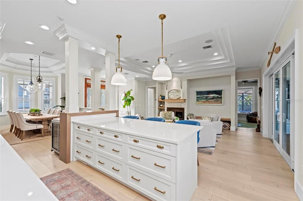 Dining room, Fireplace, Interior, Living room, Pendant Lights, Recessed Lighting, Wood Texture Flooring