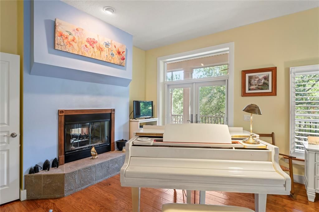 Fireplace, Interior, Piano, Recessed Lighting, Wood Texture Flooring