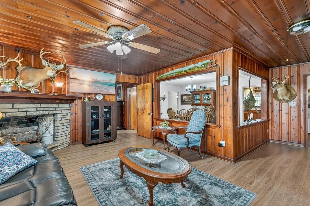 Chandelier, Dining room, Fireplace, Interior, Living room, Stone Walls, Wooden Ceilings, Wood Texture Flooring, Wooden Walls